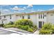 A low-rise residential building with well-maintained landscaping and a clean exterior at 200 Maitland Ave # 122, Altamonte Springs, FL 32701