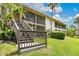 A condominium building with stairway access to screened in patios overlooking well-maintained grounds at 200 Maitland Ave # 122, Altamonte Springs, FL 32701
