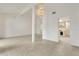 Open-concept living room showcasing a chandelier and view into the kitchen at 200 Maitland Ave # 122, Altamonte Springs, FL 32701