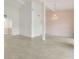 Bright and airy living room featuring tile floors, high ceilings, and a chandelier at 200 Maitland Ave # 122, Altamonte Springs, FL 32701
