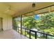 Enclosed porch with lake views, tile floor and ceiling fan at 200 Maitland Ave # 122, Altamonte Springs, FL 32701