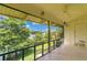 Enclosed porch with lake views and tile floor at 200 Maitland Ave # 122, Altamonte Springs, FL 32701