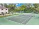 Well-maintained tennis court surrounded by trees offers recreational opportunities at 200 Maitland Ave # 122, Altamonte Springs, FL 32701