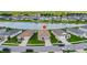 An aerial view shows the property's location in a neighborhood with a view of a pond at 200 Summershore Dr, Auburndale, FL 33823