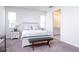 Bedroom with a queen sized bed, bench, and nightstand at 200 Summershore Dr, Auburndale, FL 33823