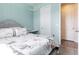 Bedroom with light blue walls, string lights, and Paris themed bedding at 200 Summershore Dr, Auburndale, FL 33823