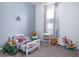 A bedroom with grey walls, a white bed with a Spiderman theme, and plenty of toys at 200 Summershore Dr, Auburndale, FL 33823