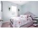 Bedroom with a grey platform bed and Paris themed bedding at 200 Summershore Dr, Auburndale, FL 33823