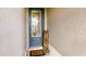 Inviting entryway with a decorative glass door, a 'Welcome' mat, and a cozy 'Home' sign at 200 Summershore Dr, Auburndale, FL 33823