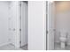 Hallway view of a half bathroom and two storage closets at 200 Summershore Dr, Auburndale, FL 33823