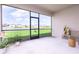 Screened patio offers expansive views of the water and backyard, with comfortable seating at 200 Summershore Dr, Auburndale, FL 33823