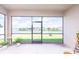 Screened patio offers expansive views of the water and backyard, perfect for outdoor enjoyment at 200 Summershore Dr, Auburndale, FL 33823