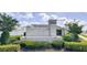 Watercrest community sign with a decorative stone wall and lush landscaping at 200 Summershore Dr, Auburndale, FL 33823