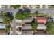 Aerial view of neighborhood showcasing house rooftops, streets, and trees at 202 Twisting Trl, Orlando, FL 32825