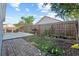 Fenced backyard featuring a patio with furniture, and garden beds at 202 Twisting Trl, Orlando, FL 32825