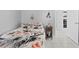 Bedroom showcasing tile floors, ceiling fan, and open doorway to another room at 202 Twisting Trl, Orlando, FL 32825