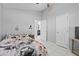 Bedroom showcasing tile floors, ceiling fan, and open doorway to another room at 202 Twisting Trl, Orlando, FL 32825