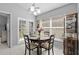 Cozy dining room with natural light, round table, and seating for four near the outdoor patio at 202 Twisting Trl, Orlando, FL 32825