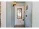 Elegant front door with decorative glass and modern hardware in a welcoming entrance at 202 Twisting Trl, Orlando, FL 32825