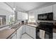 Stylish kitchen with white cabinets, butcher block counters, and stainless steel appliances at 202 Twisting Trl, Orlando, FL 32825