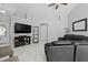 Spacious living room with tile flooring, neutral paint, ceiling fan and comfortable seating at 202 Twisting Trl, Orlando, FL 32825