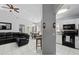 Open-concept living room flows into kitchen and dining area, perfect for entertaining at 202 Twisting Trl, Orlando, FL 32825