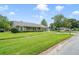 Charming single-story home boasts a well-manicured lawn, lush green shrubs, and inviting curb appeal at 20330 Majestic St, Orlando, FL 32833
