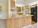 Open kitchen area featuring wood cabinets, granite countertops, and stainless steel appliances at 20330 Majestic St, Orlando, FL 32833