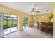 Open living room leading to screened patio and featuring a unique bar area at 20330 Majestic St, Orlando, FL 32833