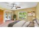 Comfortable main bedroom with natural light, a ceiling fan, and access to a screened patio at 20330 Majestic St, Orlando, FL 32833