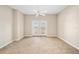 Spacious, carpeted bedroom with ceiling fan and private access to the outdoors at 2305 Edgewater Dr # 1509, Orlando, FL 32804
