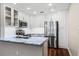 Stylish kitchen featuring stainless steel appliances, light countertops, and modern fixtures at 2305 Edgewater Dr # 1509, Orlando, FL 32804