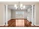 Inviting living room with hardwood floors, plantation shutters, and built-in shelving at 2305 Edgewater Dr # 1509, Orlando, FL 32804
