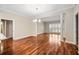 Spacious living area with hardwood flooring, bright natural light, and decorative columns at 2305 Edgewater Dr # 1509, Orlando, FL 32804