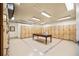 Functional locker room with ample storage and a wooden table at 2305 Edgewater Dr # 1509, Orlando, FL 32804