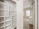 Walk-in closet with custom shelving and drawers, providing ample storage space at 2305 Edgewater Dr # 1509, Orlando, FL 32804