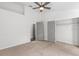Spacious bedroom with closet and view of another room beyond double doors at 25 Reflections Village Dr, Ormond Beach, FL 32174