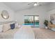 Bedroom featuring a queen-sized bed, sliding glass door, vaulted ceiling, and a modern ceiling fan at 25 Reflections Village Dr, Ormond Beach, FL 32174