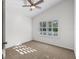 Bright bedroom with neutral carpet, ceiling fan, plantation shutters, and natural light at 25 Reflections Village Dr, Ormond Beach, FL 32174