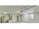 Large garage featuring utility sink, hot water tank, and room for storage at 25 Reflections Village Dr, Ormond Beach, FL 32174