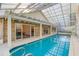 This indoor pool is accessible from the home by two sets of sliding glass doors at 25 Reflections Village Dr, Ormond Beach, FL 32174