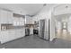 Modern kitchen featuring stainless steel appliances, a stylish backsplash, and ample cabinet space at 25 Reflections Village Dr, Ormond Beach, FL 32174