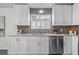 Well-appointed kitchen with granite countertops, stainless steel appliances, and subway tile backsplash at 25 Reflections Village Dr, Ormond Beach, FL 32174