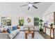 Bright living room with hardwood floors, neutral colors, stylish furnishings, and large windows at 25 Reflections Village Dr, Ormond Beach, FL 32174