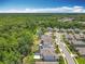 Aerial view of a residential neighborhood with pools, green spaces, and access to a nature preserve at 2676 Estuary Loop, Oviedo, FL 32765