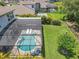 Aerial view of the screened pool, well-maintained lawn, and backyard of the home in a community at 2676 Estuary Loop, Oviedo, FL 32765