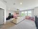 Cozy bonus room with comfortable seating, a flat-screen TV, and a play area for the  at 2676 Estuary Loop, Oviedo, FL 32765