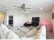 Cozy bonus room with comfortable seating, a flat-screen TV, and a play area for the  at 2676 Estuary Loop, Oviedo, FL 32765