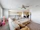 Bright bonus room with plush seating and an adjacent office area for work or study at 2676 Estuary Loop, Oviedo, FL 32765