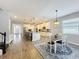Open-concept dining area that leads to a gourmet kitchen with barstool seating at the island at 2676 Estuary Loop, Oviedo, FL 32765